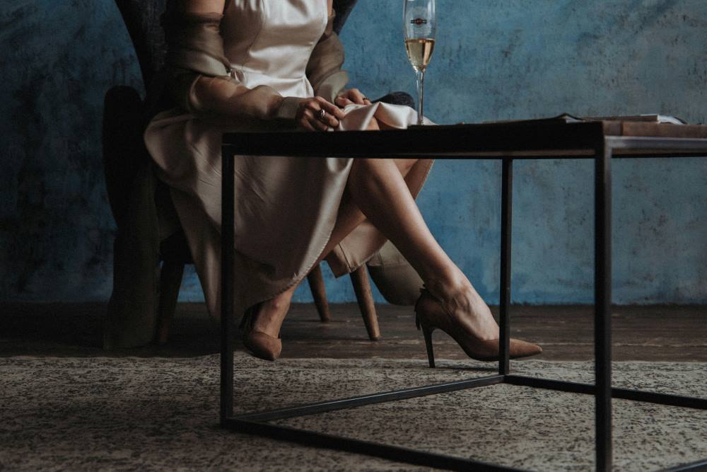 High class woman sitting at a table