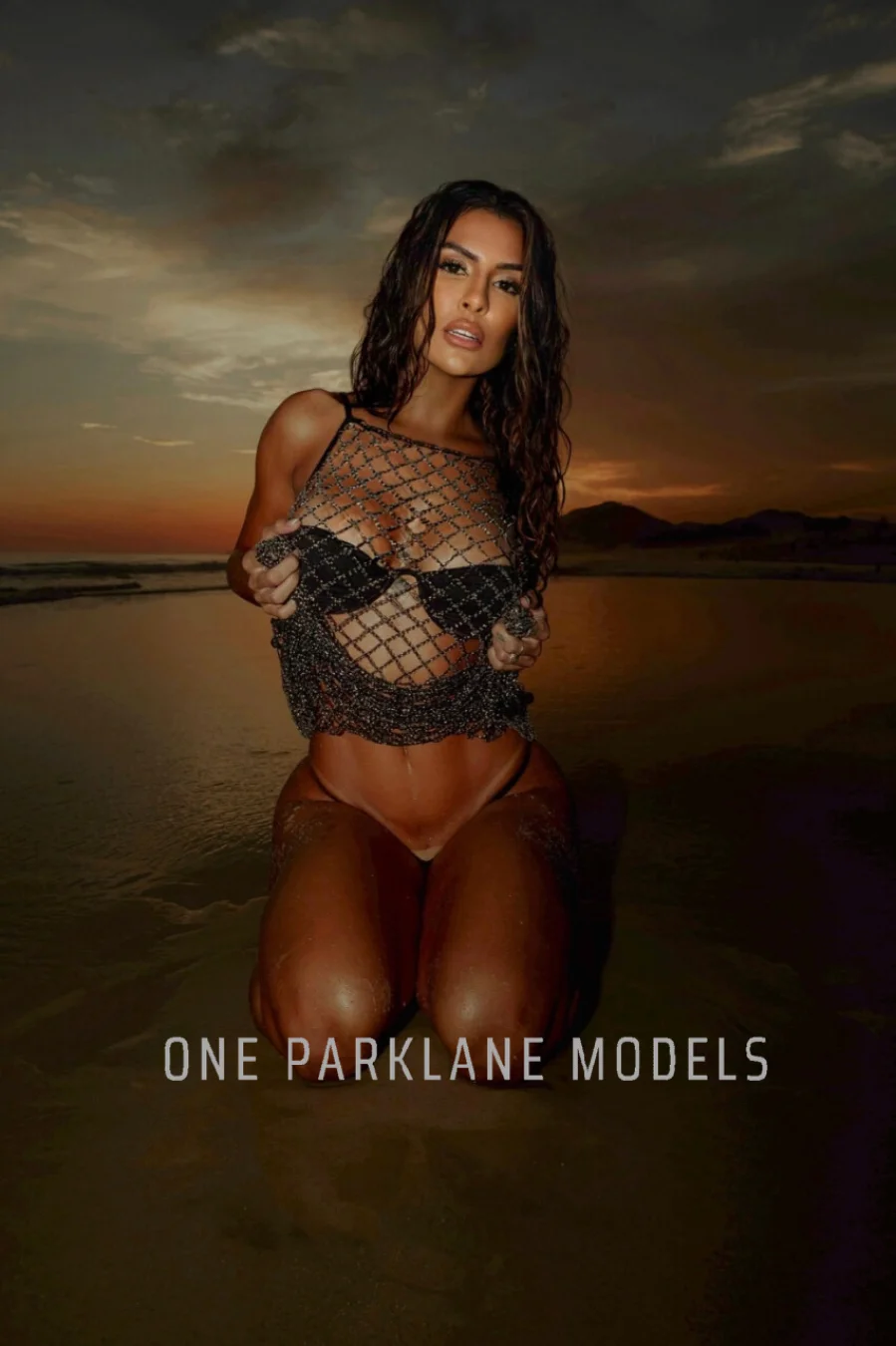 Vicky posing in a bikini on a beach